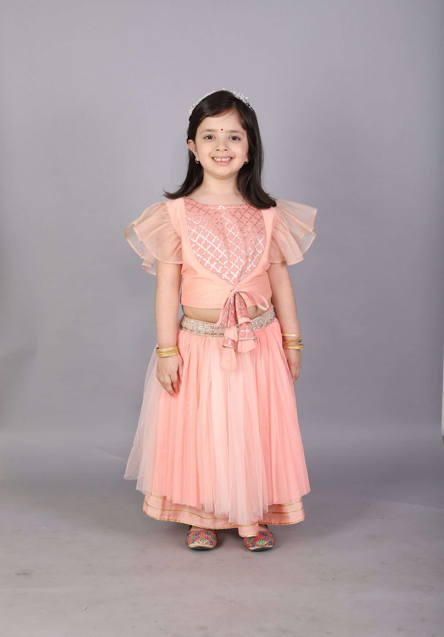 Peach frilly top with Double layered net Lehnga