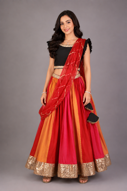 Black Ruffled blouse with multi color lehnga
