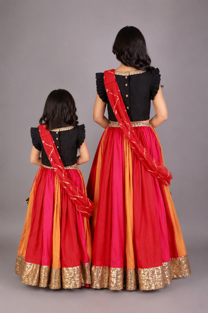 Black Ruffled blouse with multi color lehnga