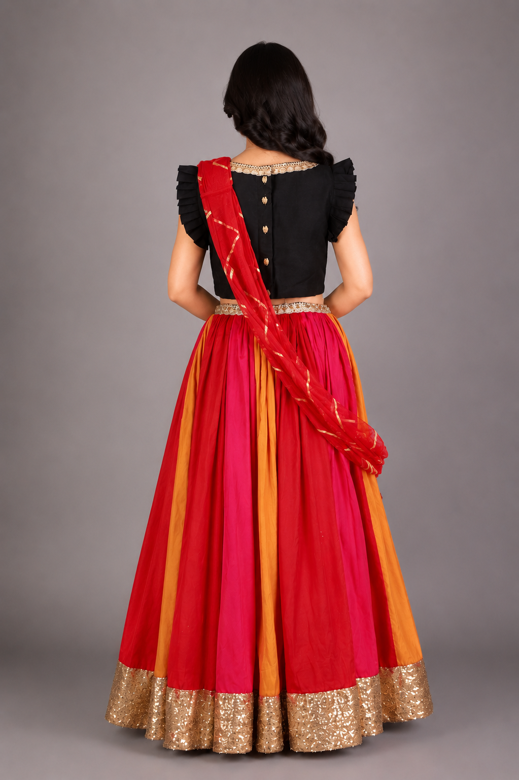 Black Ruffled blouse with multi color lehnga