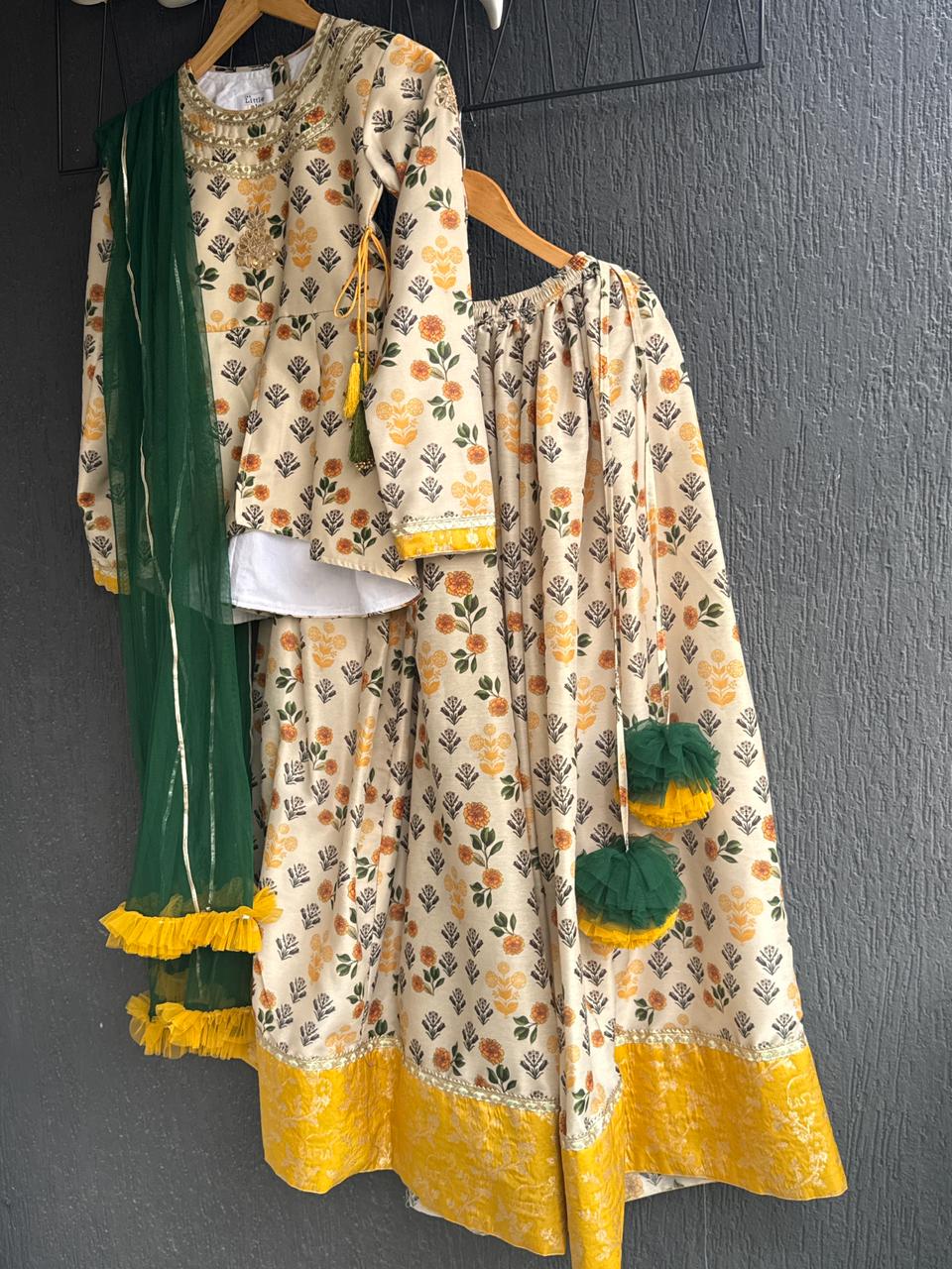 Marigold Printed peplum top With Lehenga And Net Dupatta